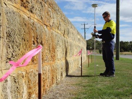 Surveyor performing boundary identification