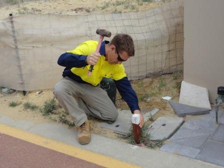 Surveyor at boundary repeg site